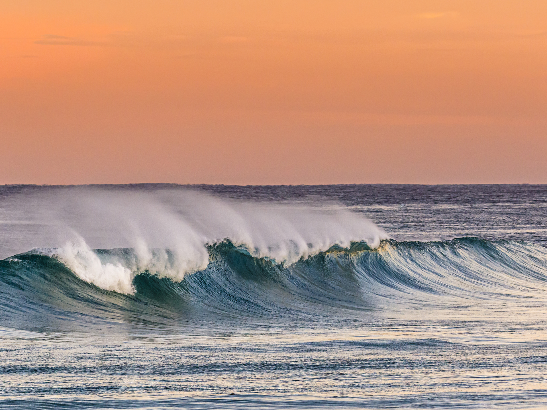 wave sunset image crashing