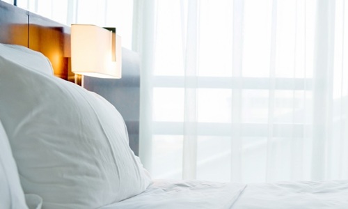 bed with orange lamp 