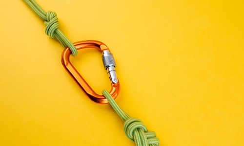 carabiner on yellow background